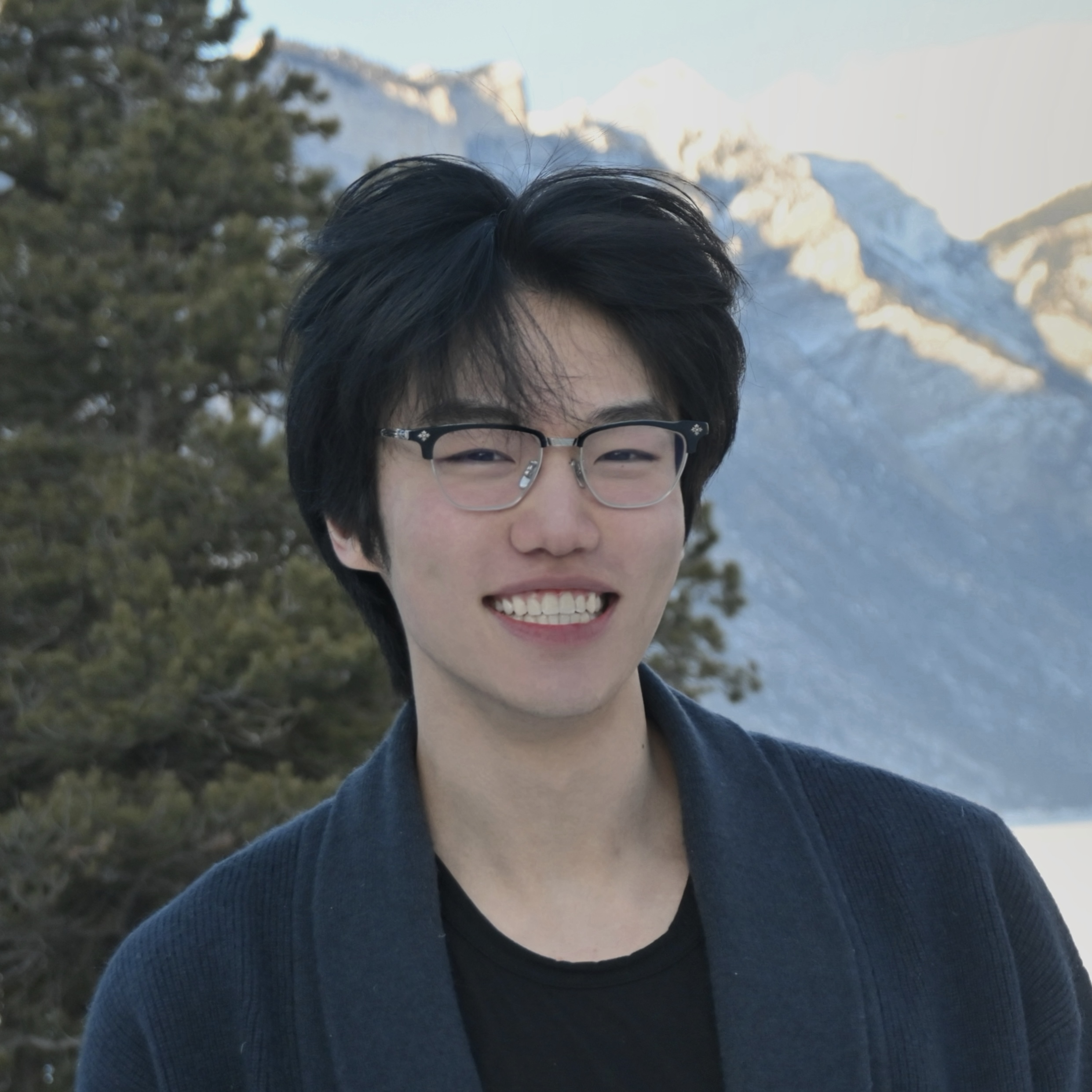 Zekun Song outdoors in the mountains